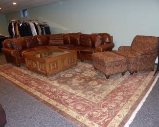 Leather sectional sofa, club chair & ottoman, cocktail table, area rug