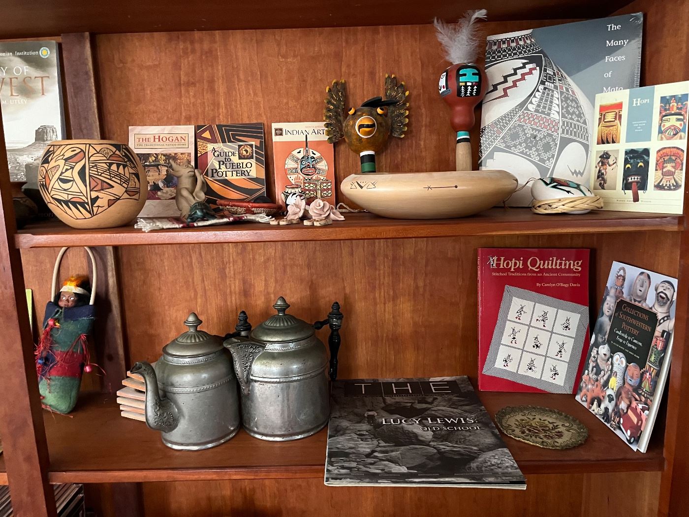Hopi pottery and gourd rattles.  Antique pewter coffee pots.