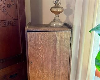 Antique record cabinet and oil lamp