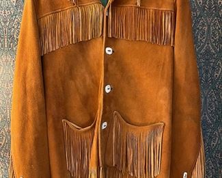 Men’s handmade doe skin jacket with hand cut fringe and bone buttons circa 1940’s