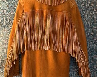 Men’s handmade doe skin jacket with hand cut fringe and bone buttons.  1940’s