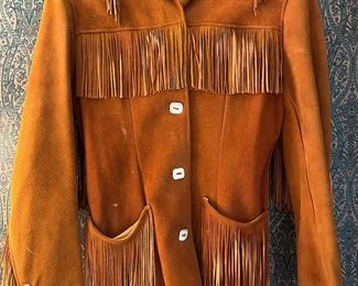 Womens handmade doe skin jacket with hand cut fringe and bone buttons