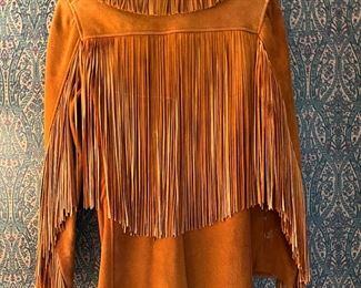 Womens handmade doe skin jacket with hand cut fringe and bone buttons. 1940’s