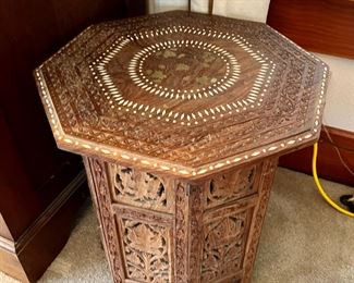 Octagonal carved wood table with brass inlay from India