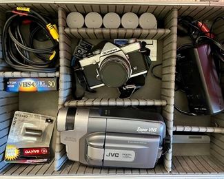 Olympus OM-1 SLR camera and JVC digital video camera