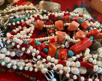 Fine jewelry.  Necklaces of pearls, coral, turquoise, Venetian glass beads, garnets and more.