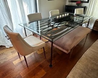 Glass-top and iron base dining table