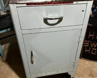 Small light blue metal cabinet