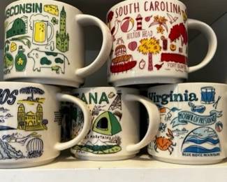 Collection of Starbucks travel mugs