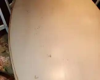 distressed dining table with 6 chairs, by Woodland, top shown