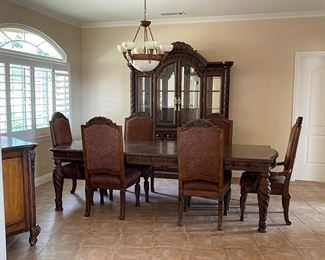 Designer table with six chairs (pictured with the removable leaves). Like new condtion. Great BUY!