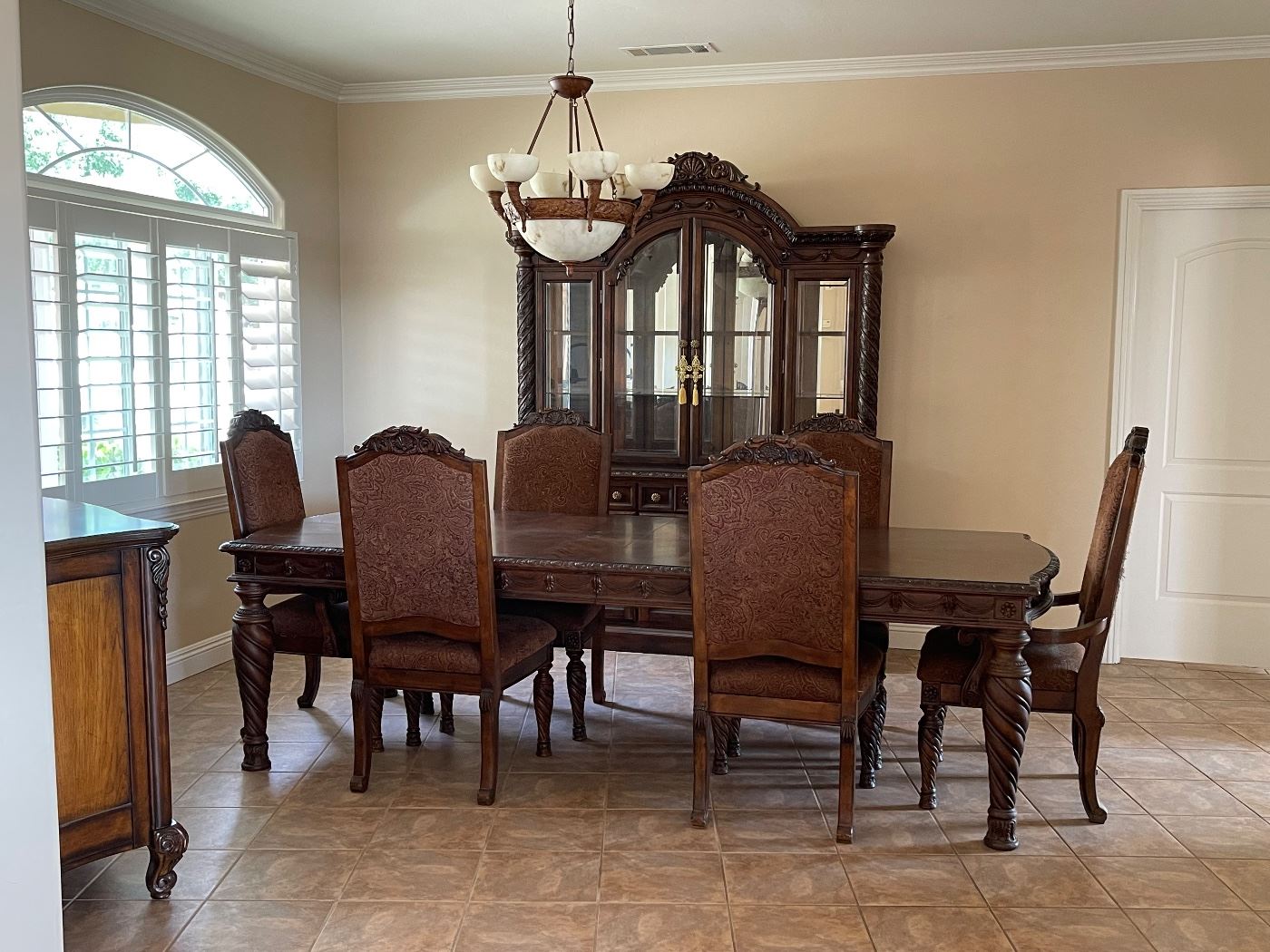 Designer table with six chairs (pictured with the removable leaves). Like new condtion. Great BUY!