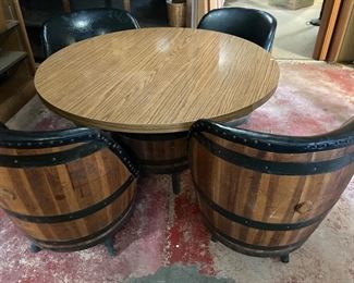 Round table with 4 whiskey barrel chairs