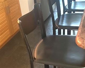 Four black leather (faux?) counter stools 