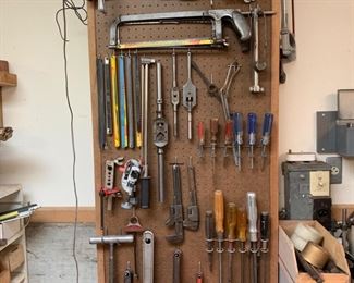 Pegboard of Tools, Pipe Wrenches, Saws