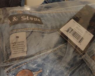 Many many pairs of jeans new in package and hanging. Sizes 16 and up
