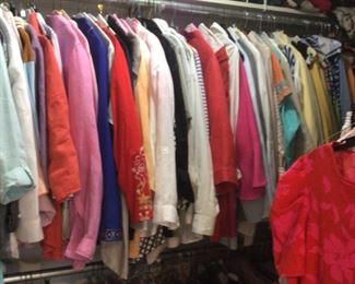 tons of designer clothes and bags