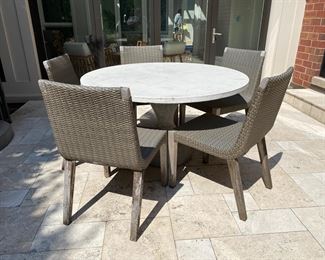Janus et Cie dining chairs together with concrete dining table