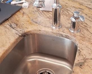 Kitchen island has a small sink