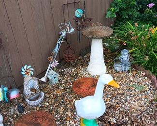 MORE LAWN DECOR . THERE ARE SEVERAL OUTFITS FOR THE GOOSE INSIDE THE HOUSE