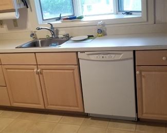 Classic kitchen with lots of base and upper cabinets; dishwasher