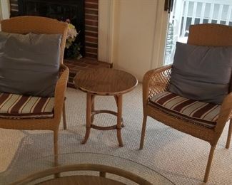 Wicker armchairs and accent table