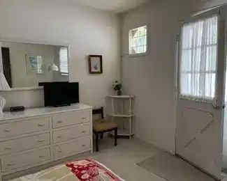 Entry door; bedroom furnishings including matching dresser, headboard, mirror & nightstand