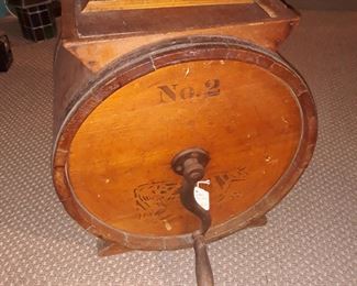 Antique  butter churn 
With stenciled image of Dairy Cow