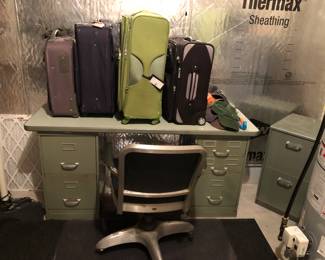 Vintage metal desk, office chair, luggage