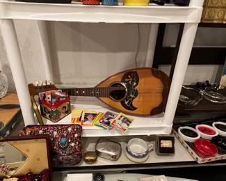 The musical instrument here… Mandolin? I don’t even know;  need some repair, but it’s awful cool