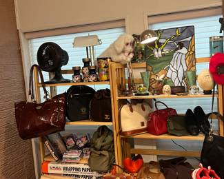 Fancy purses, Falcor from the never ending story… Some Star Wars stuff… Some amazing hand tied fly fishing flies… An awesome pair of Nike air maxes… Several large Stainglass panels