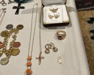 Several nice pieces of gold including a pair of earrings with some diamonds. 
10k up top, think everything else is 14k
(close-ups of individual pieces will be at the very end of the pictures!)