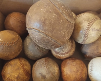 Lots of leather Softball and Baseballs