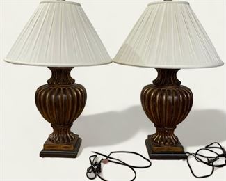 Pair of gilt finished footed urn-style table lamps. High quality with cotton shade (32 inches H)
