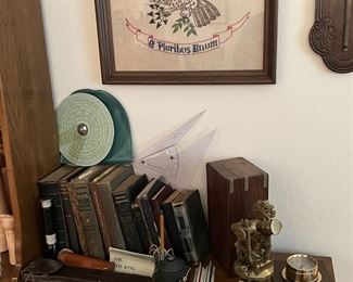 Old engineering, plumb bob, slide rulers, scope, books