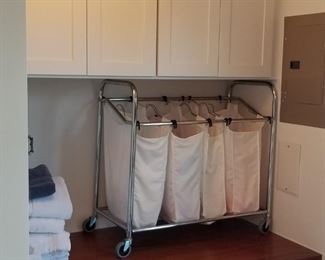 Laundry room cabinets and laundry aids