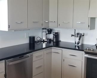 Pretty kitchen is painted wood with beautiful updated cabinet hardware