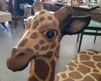 Concrete giraffe bench available Weds inside AVW