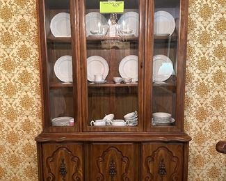 this china cabinet is petite in stature…