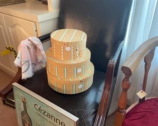 Hat boxes and leather office chair