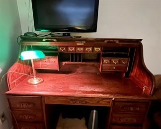 This roll top desk is a reproduction and boy do these drawers open and close smoothly with the ball-bearing drawer slides. The photo doesn't do justice to the details in this piece.