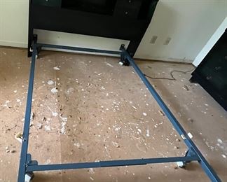 The full-size bedframe completes this Black MCM bedroom ensemble.