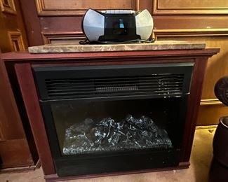 Portable, electric fireplace. Nice to look at. Even nicer to sit by, on those chilly nights. **Fall is right around the corner!**