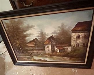 European landscape with stone bridge over river, plus stone buildings.