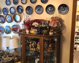 Some of collector plates curved glass China cabinet 