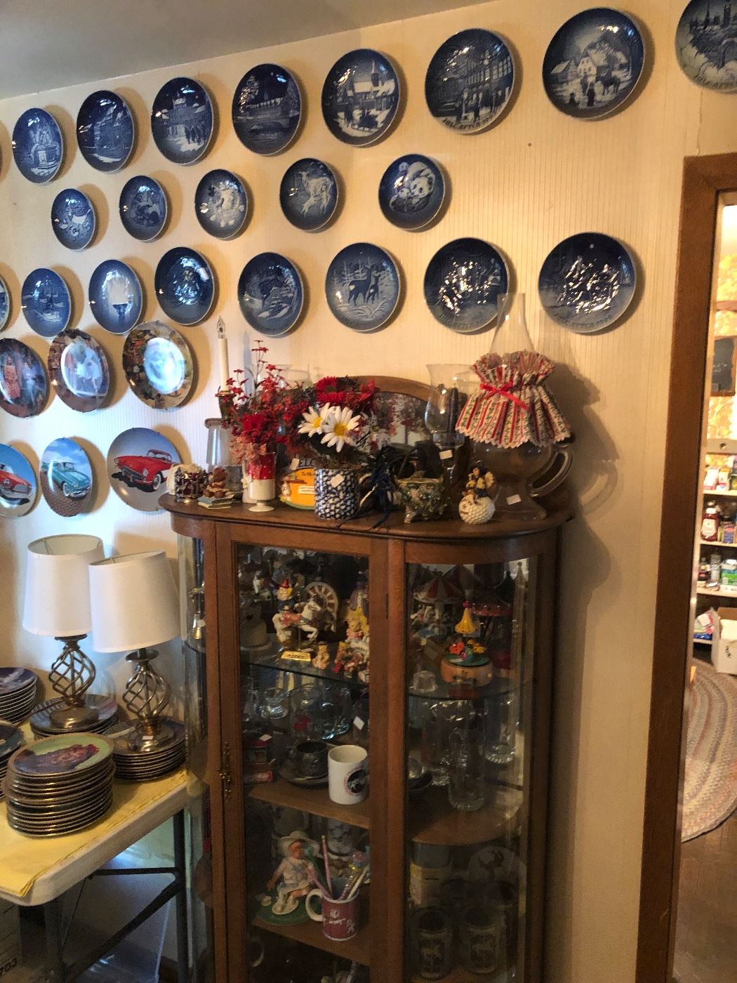 Some of collector plates curved glass China cabinet 