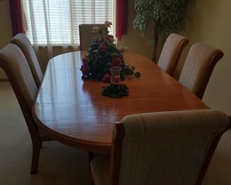 Formal dining room table is for sale and includes 6 chairs as well as the china cabinet