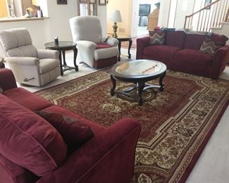 Lamps, and the four table set are for sale. Area rug is for sale velvet couches are for sale.