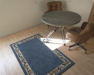 Table has three chairs (one in garage)