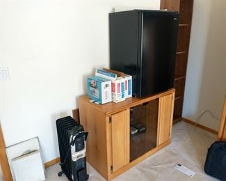 TV stand, heater and corner bookcase for sale.